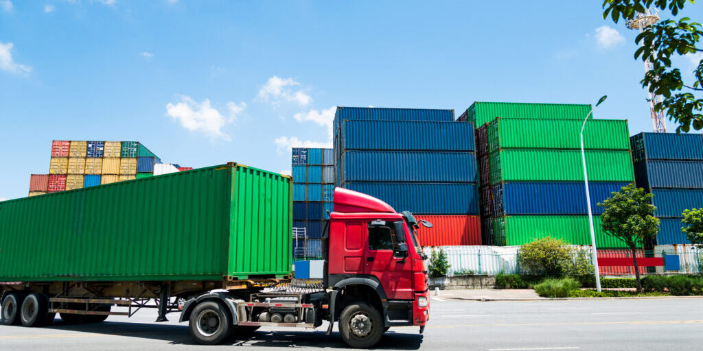 Truck transport container leaving the harbor.